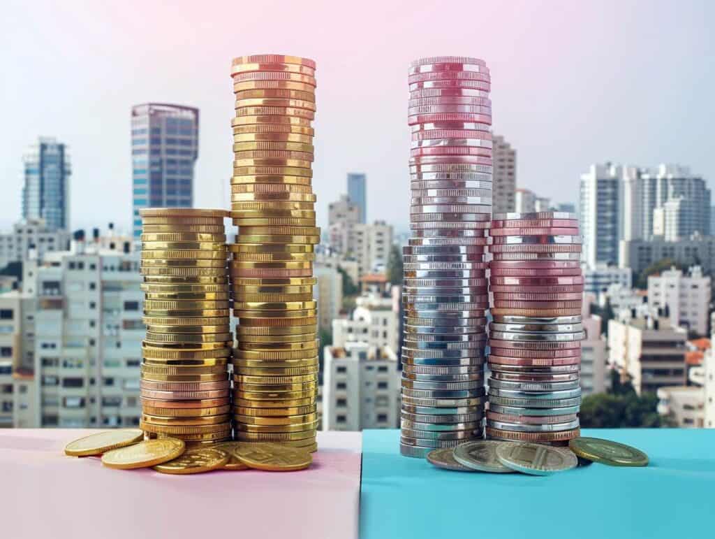 ערימות מטבעות מסמלות פערי מס רכישה ומס שבח בין ערים בישראל, לפי דו"ח רשות המיסים 2024